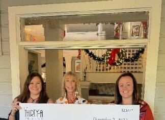 Café Thirty-A Raises Record-Breaking $50,000 for Caring and Sharing of South Walton Cta Check Presentation Photo